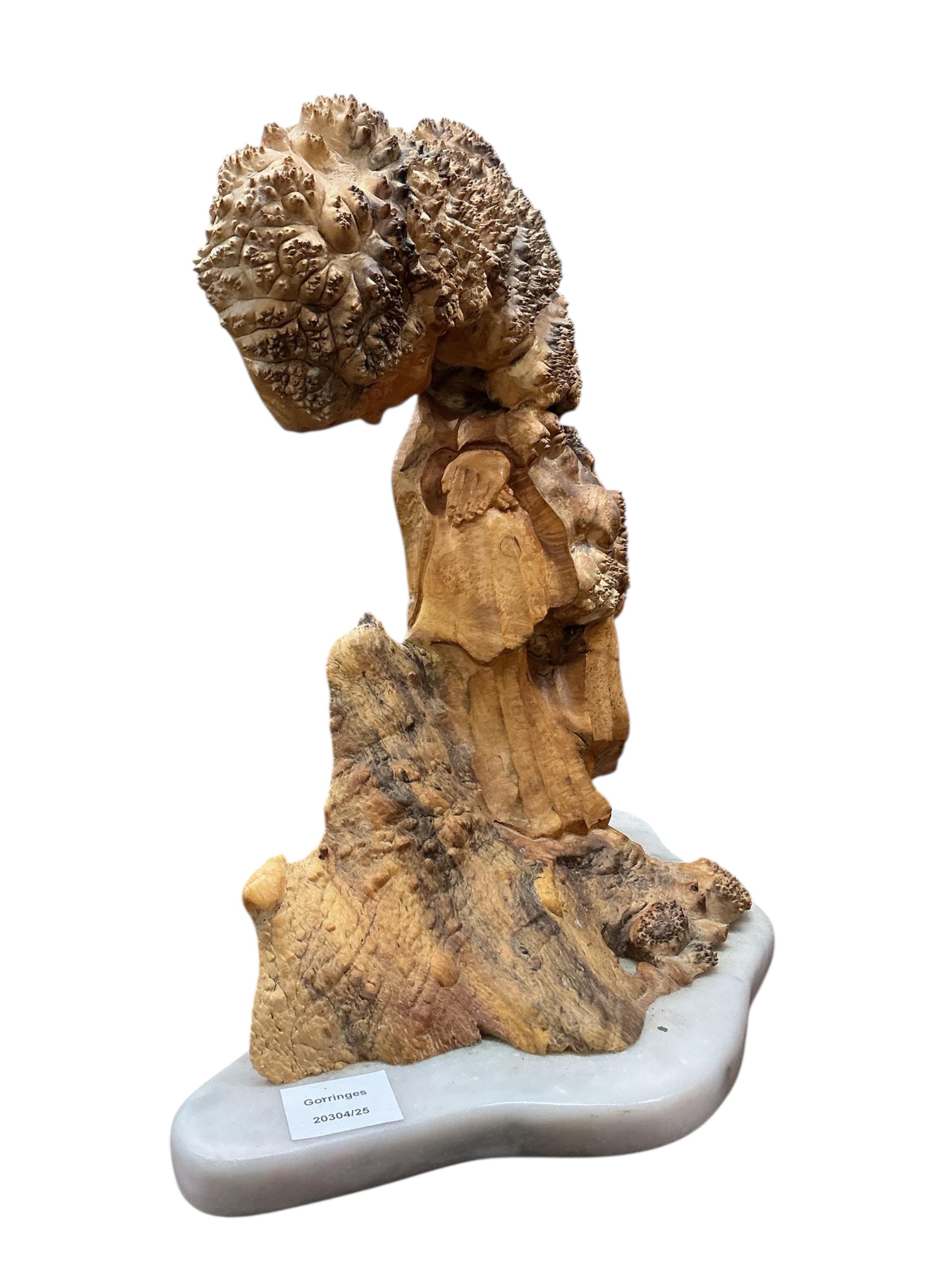 Pierre Decorse (b.1953), a stylised sculpture of a woman with head bowed, raised on a white marble base, height 40cm